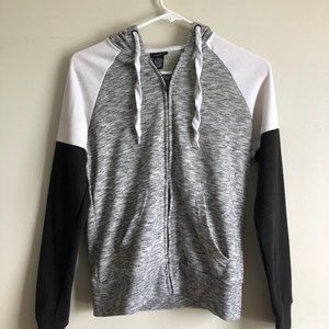 Grey, white, and black zip-up jacket